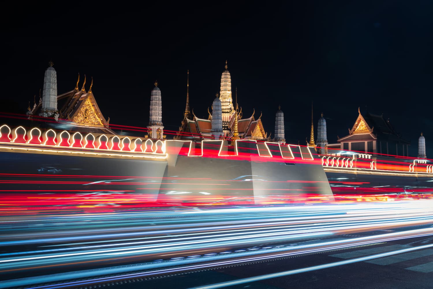 Traffic light trails near the Grand Palace at night