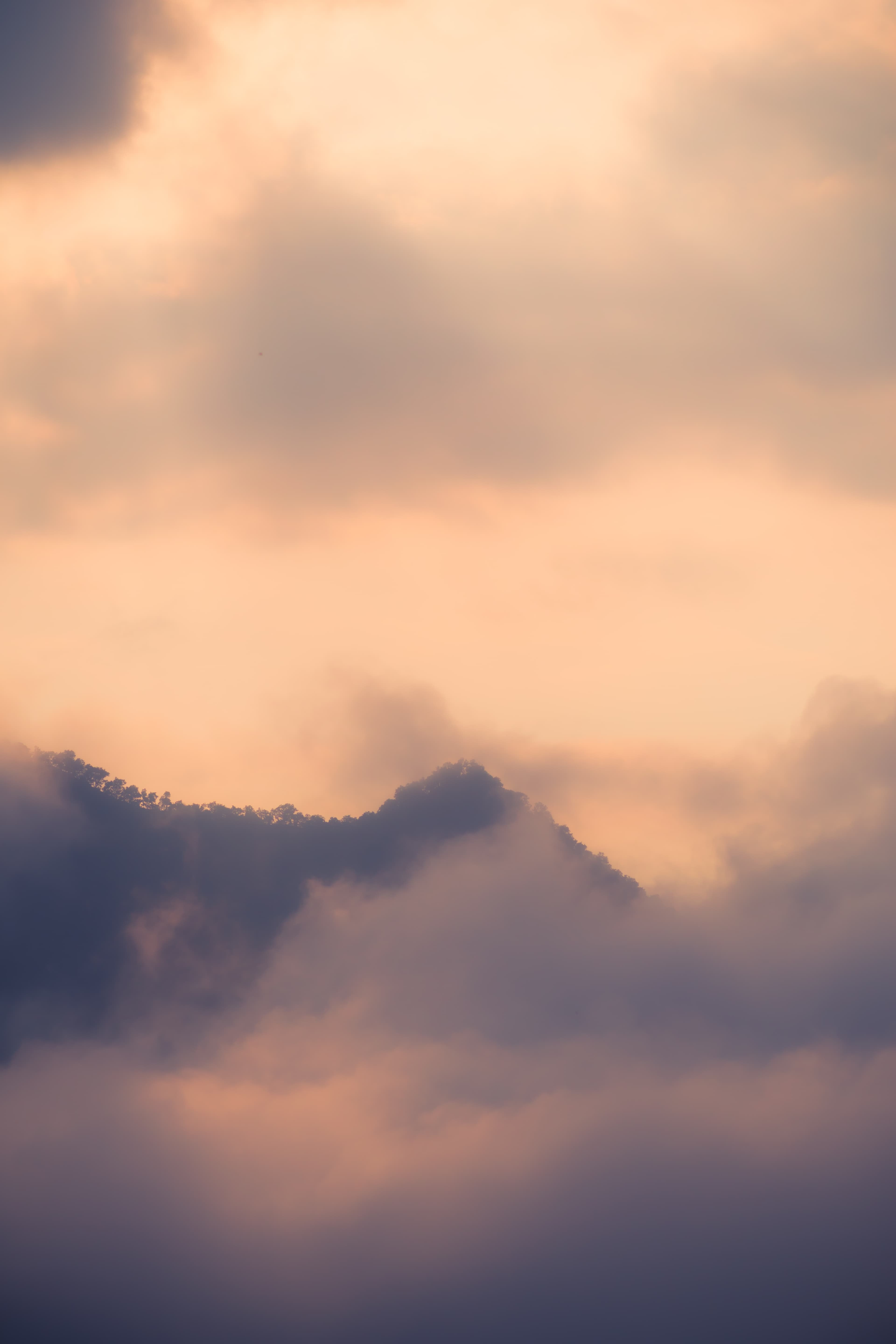 Dramatic clouds drifting over distant mountain peaks, Phu Tok, Chiang Khan, Loei
